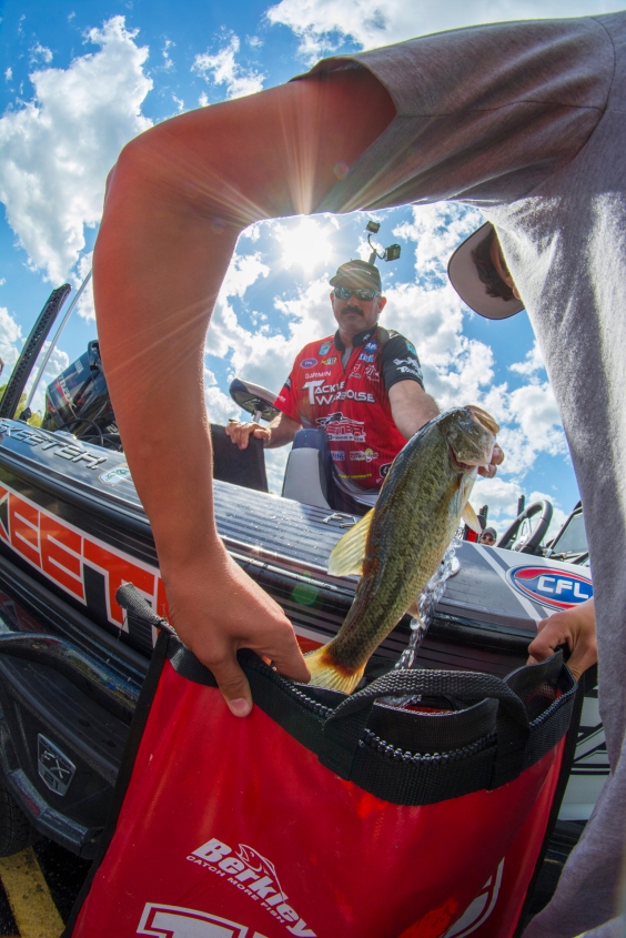 Garmin pro Jared Lintner loads up while son JC holds his bag. Photo by Joel Shangle.